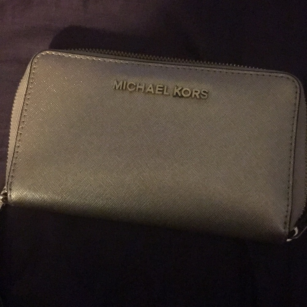 Michael Kors clutch holds IPhone 6